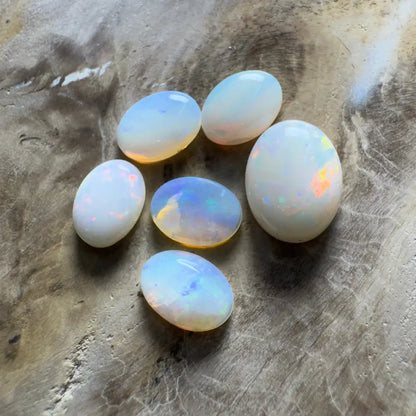 Collection of iridescent opal gemstones.