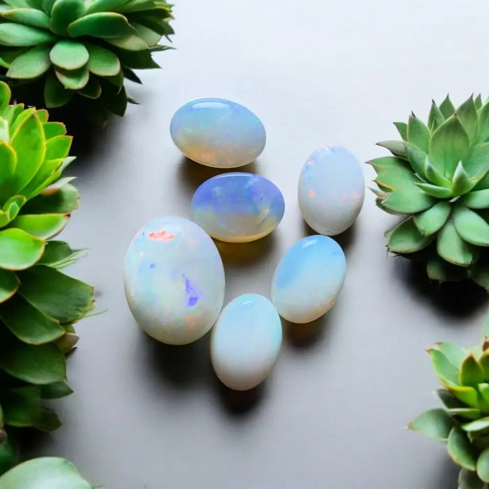 Opal gemstones with iridescent flashes.