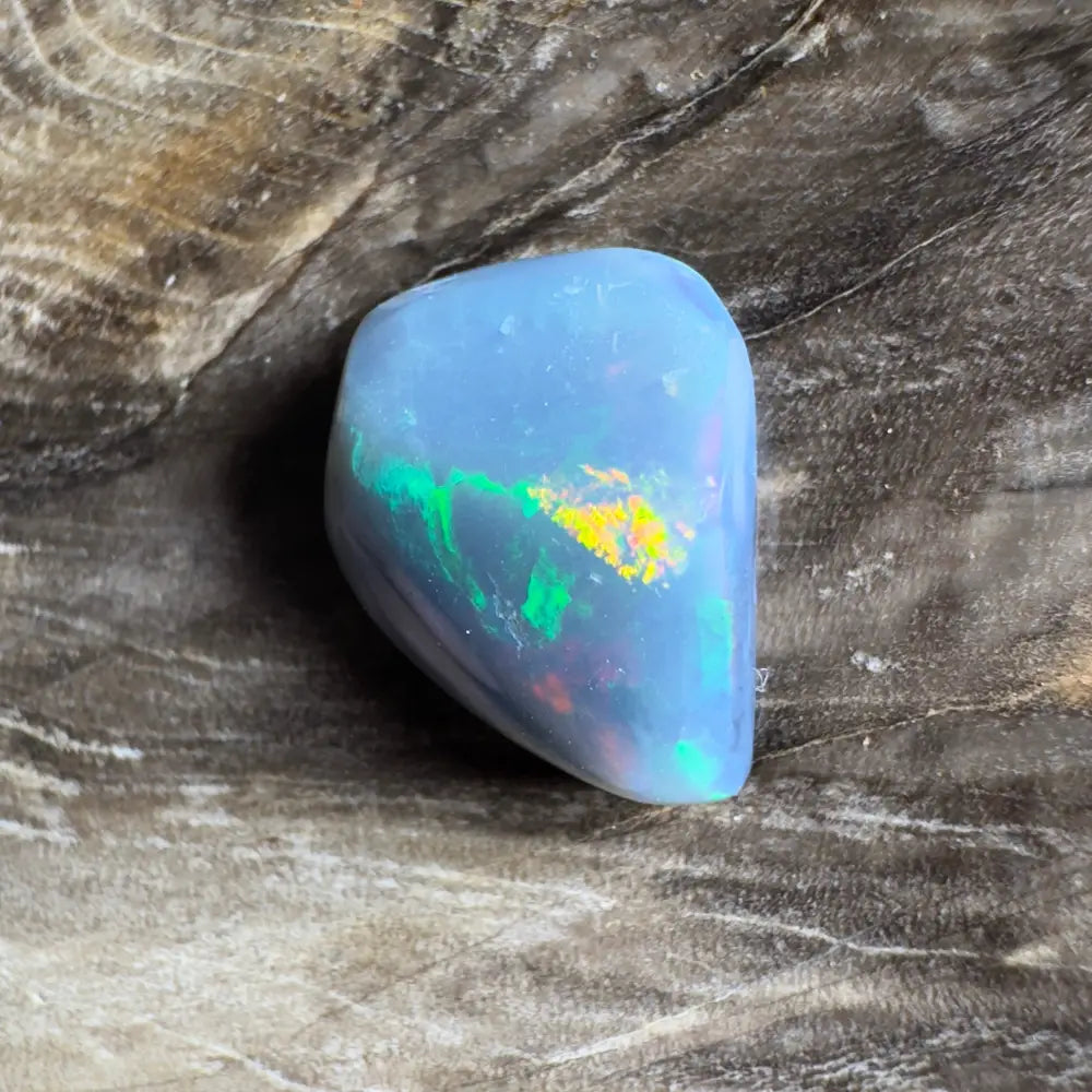 Polished blue opal with iridescent flashes.