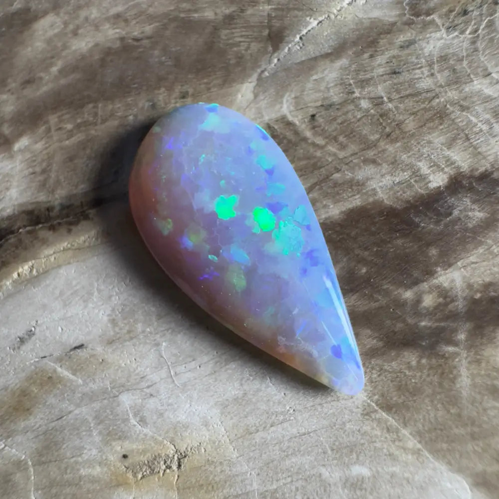 Iridescent teardrop-shaped opal.