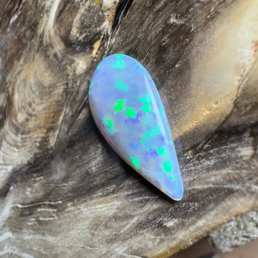 Iridescent teardrop-shaped opal.