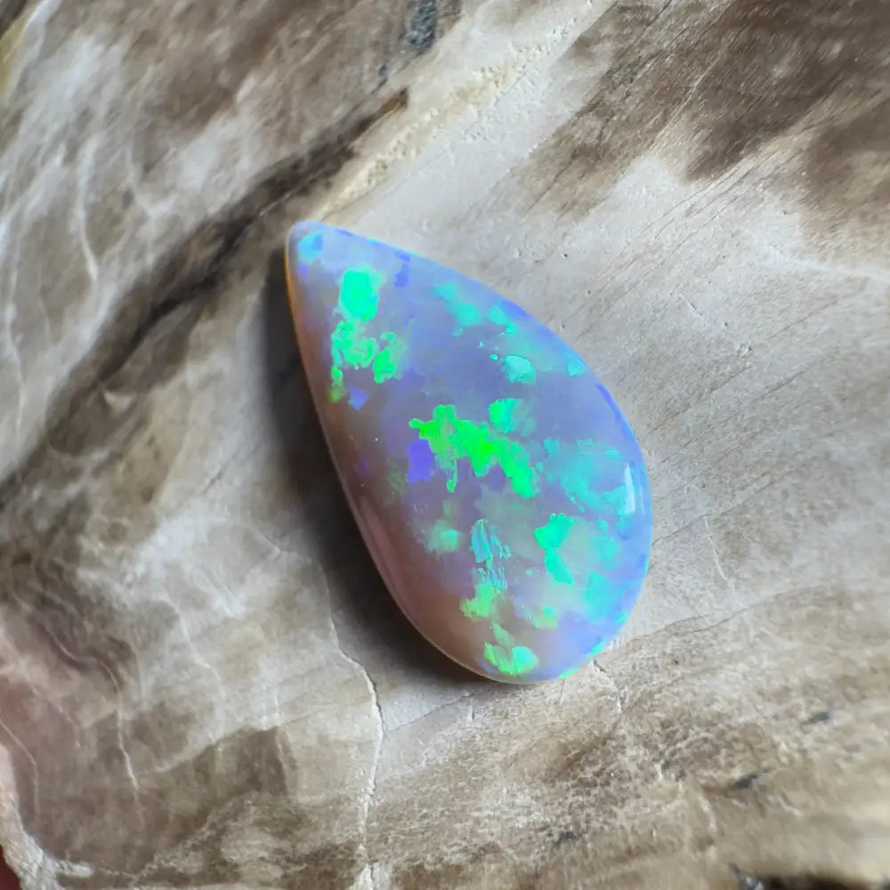 Teardrop-shaped opal with green and blue play-of-color.