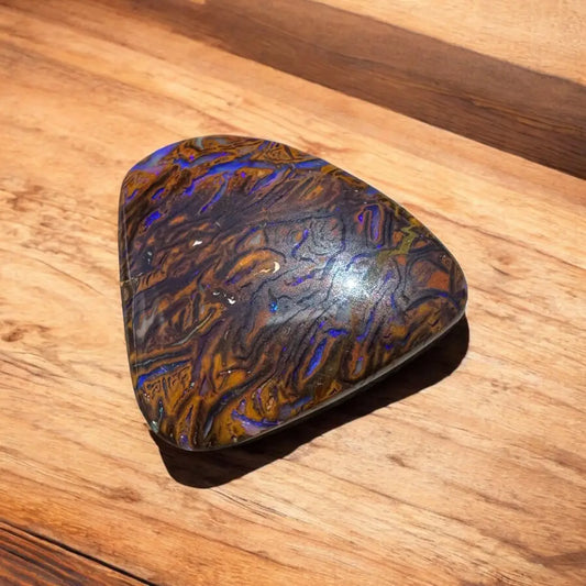 Polished 7.8ct Hand-cut Queensland Boulder Opal showcasing vibrant color play