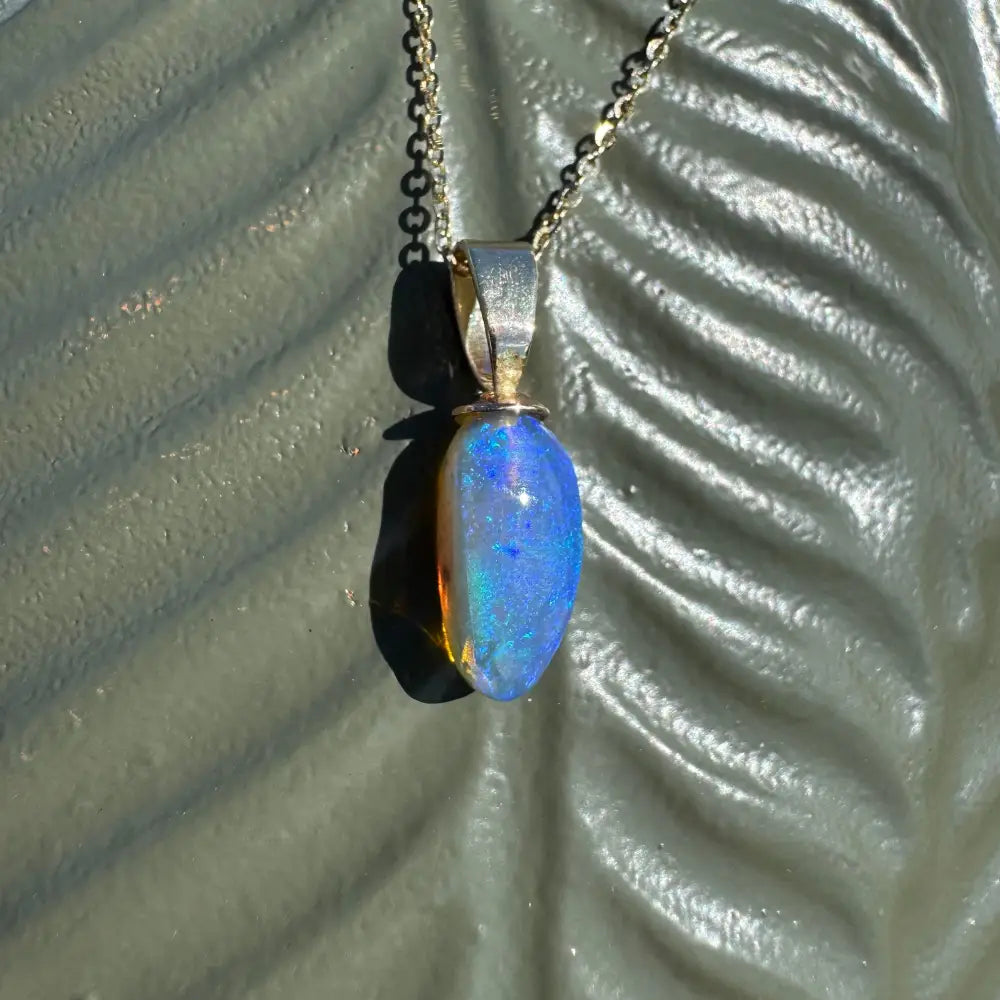 Opal pendant necklace from Airlie Waters featuring a handcrafted 9ct solid gold setting and Lightning Ridge opal gemstone