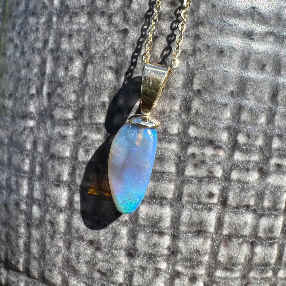 Opal pendant with gold chain from the Airlie Waters handcrafted jewelry collection