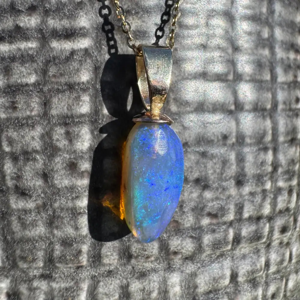 Opal pendant necklace from Airlie Waters featuring a handcrafted 9ct solid gold and Lightning Ridge opal