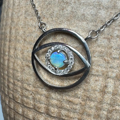 Silver eye-shaped pendant necklace with vibrant opal center from Lightning Ridge in sterling silver