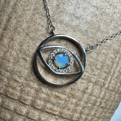 Silver eye-shaped pendant necklace with a luminous opal center from Lightning Ridge