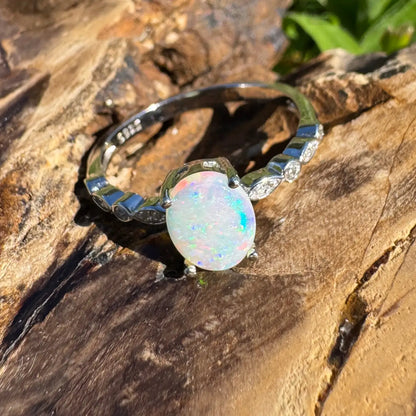 Silver ring featuring iridescent Coober Pedy crystal opal in handcrafted design