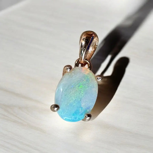 Oval opal pendant with rose gold setting from Blue Water Cove handcrafted 0.8ct Lightning Ridge Opal