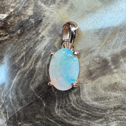 Oval opal pendant with rose gold setting from Blue Water Cove handcrafted jewelry collection