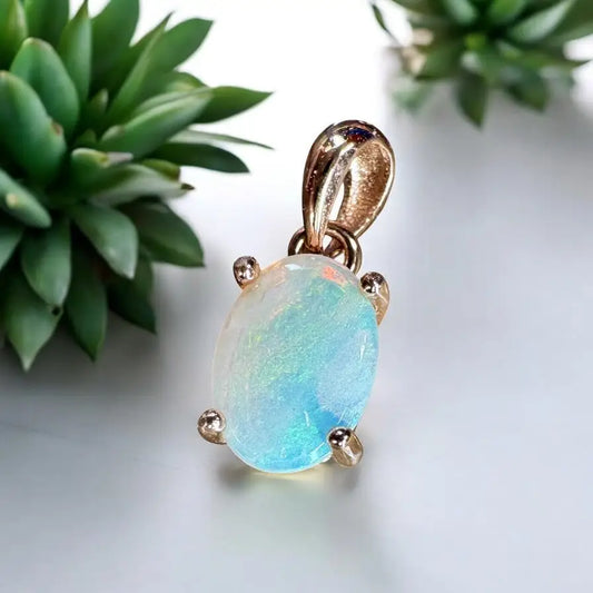 Oval opal pendant with gold prongs from Blue Water Cove handcrafted Lightning Ridge opal necklace