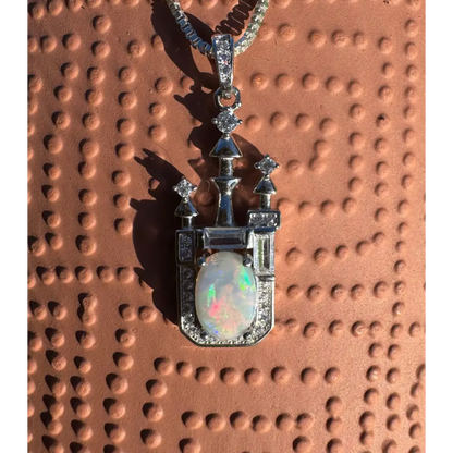 Castle-shaped opal pendant necklace featuring handcrafted Lightning Ridge opal and cubic zirconia in sterling silver
