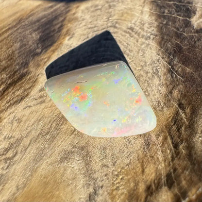 Iridescent opal gemstone from Coober Pedy Belemnite Opal fossilized squid in 2.1 carats