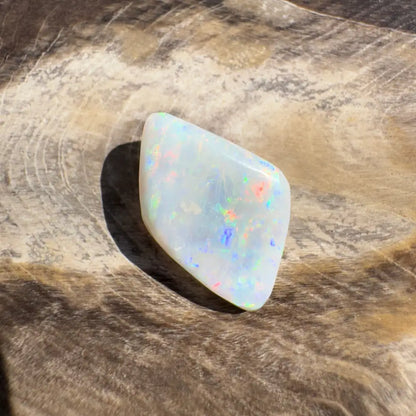 Iridescent white opal gemstone from Coober Pedy Belemnite Opal 2.1 carat solid product