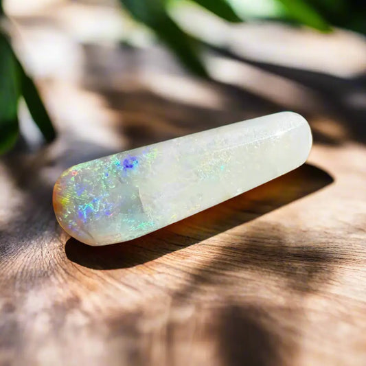 Polished Coober Pedy Belemnite Opal wand with iridescent play-of-color for jewelry or collection