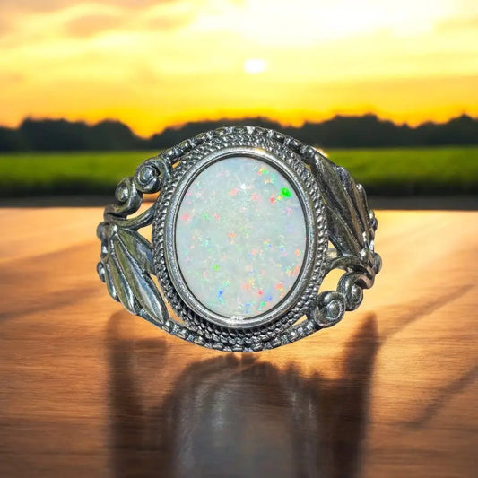 Silver ring featuring an oval Coober Pedy opal with handcrafted 1ct solid opal design