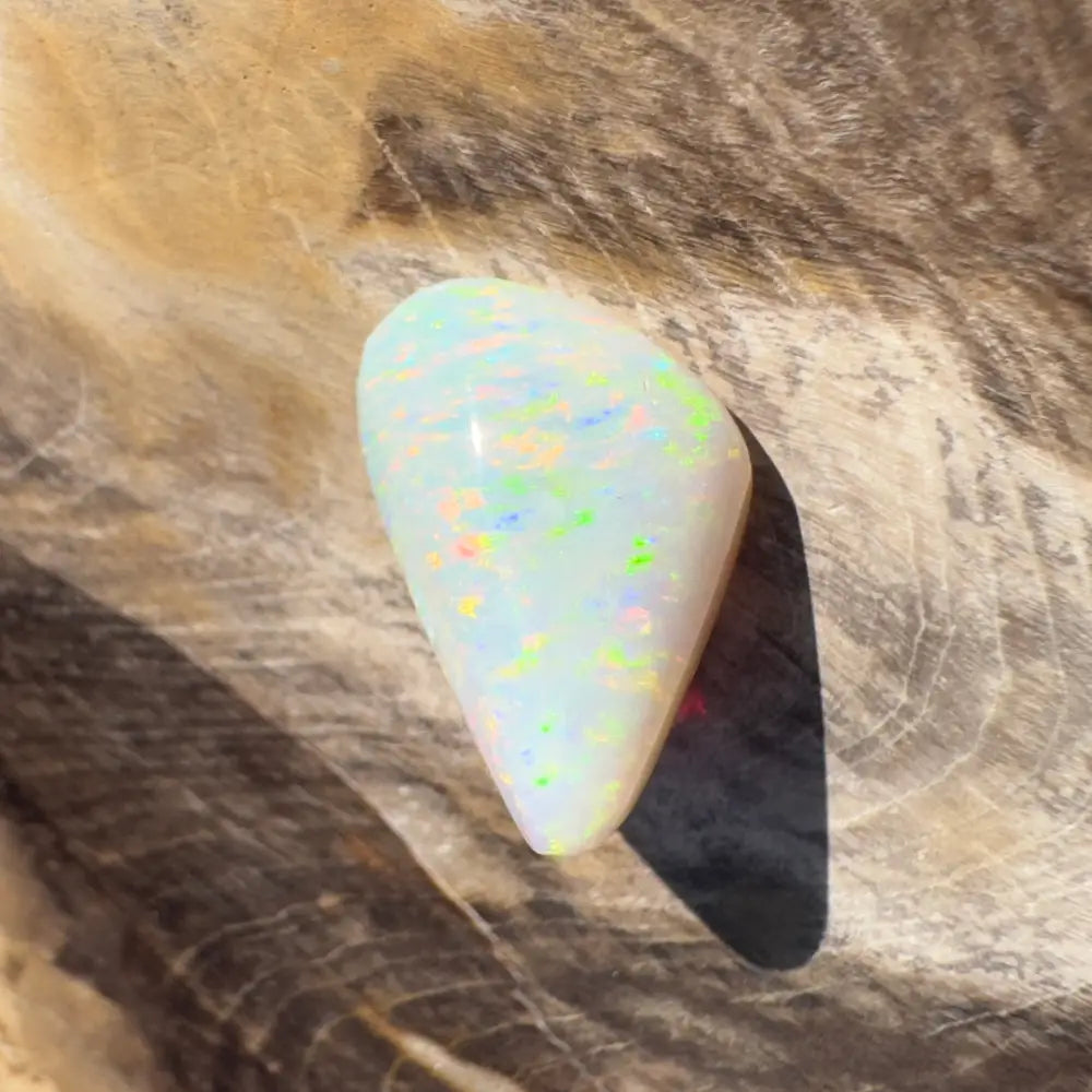 Iridescent white opal gemstone from Coober Pedy weighing 4.3 carats, hand-cut and solid