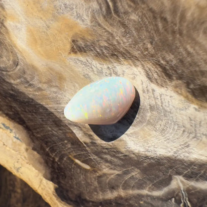 Iridescent Coober Pedy Opal gemstone showcasing vibrant colors and natural beauty