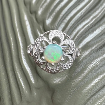 Silver opal flower ring with a 0.7ct Lightning Ridge opal in a Sterling Silver setting