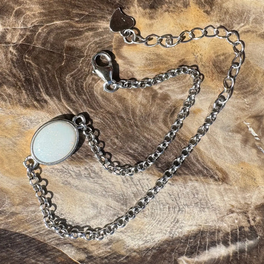 Silver chain bracelet with white oval Coober Pedy opal gemstone in handcrafted sterling silver