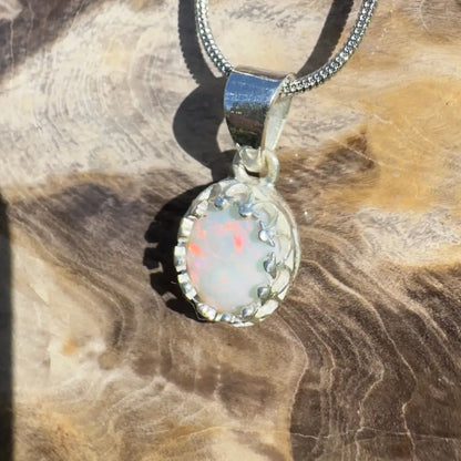 Silver opal pendant necklace.