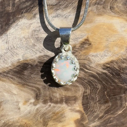 Silver opal pendant necklace.