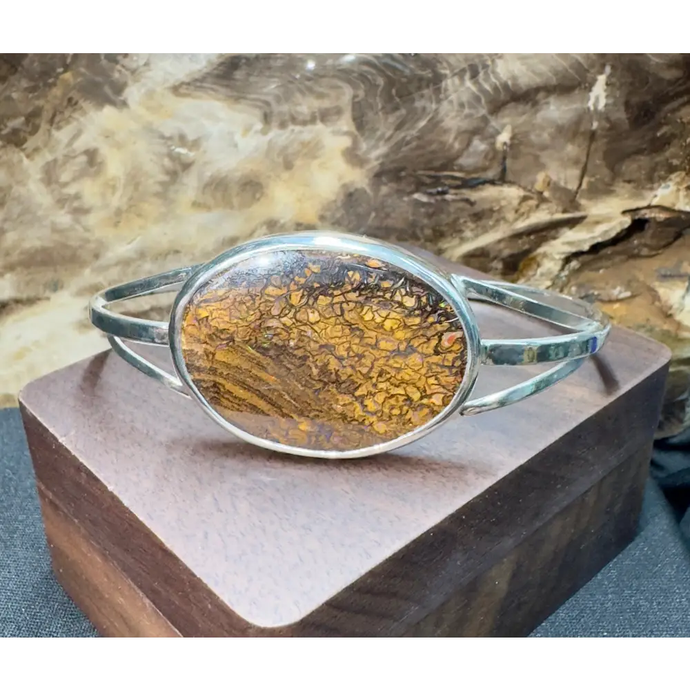 Silver bracelet with brown patterned stone.