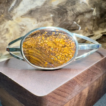Silver bracelet with cracked amber stone.