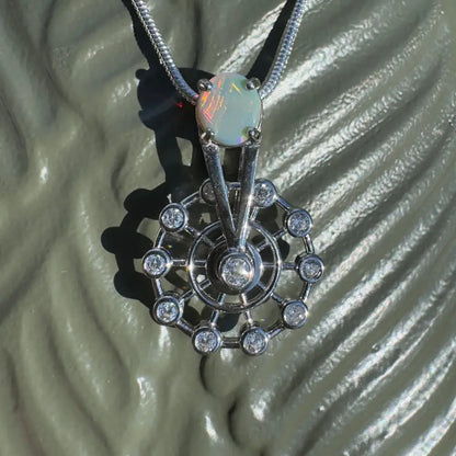 Opal and diamond pendant necklace featuring a handcrafted Lightning Ridge Opal and sterling silver ferris wheel design