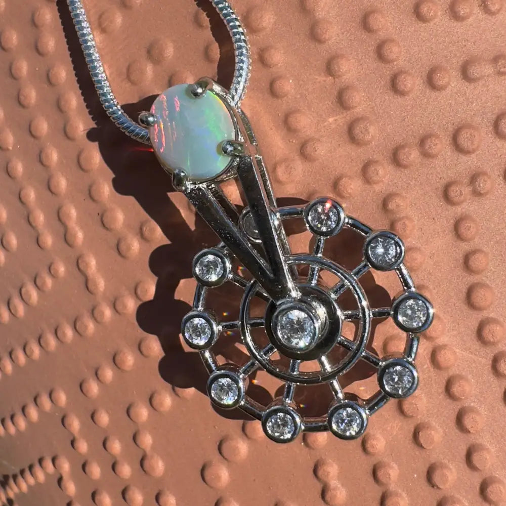 Opal and diamond pendant necklace with sterling silver spinning ferris wheel design