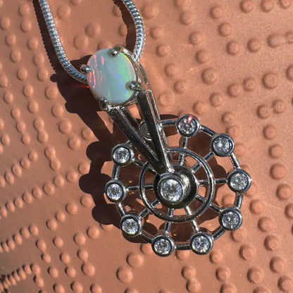 Opal and diamond pendant necklace with sterling silver spinning ferris wheel design