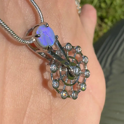 Silver pendant featuring a Lightning Ridge opal and diamond accents in sterling silver
