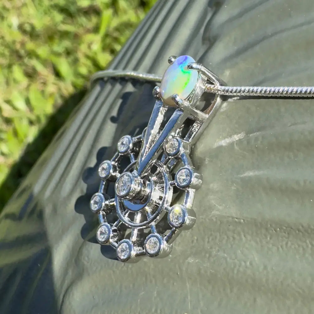 Handcrafted Lightning Ridge Opal and diamond pendant with Sterling Silver spinning ferris wheel design