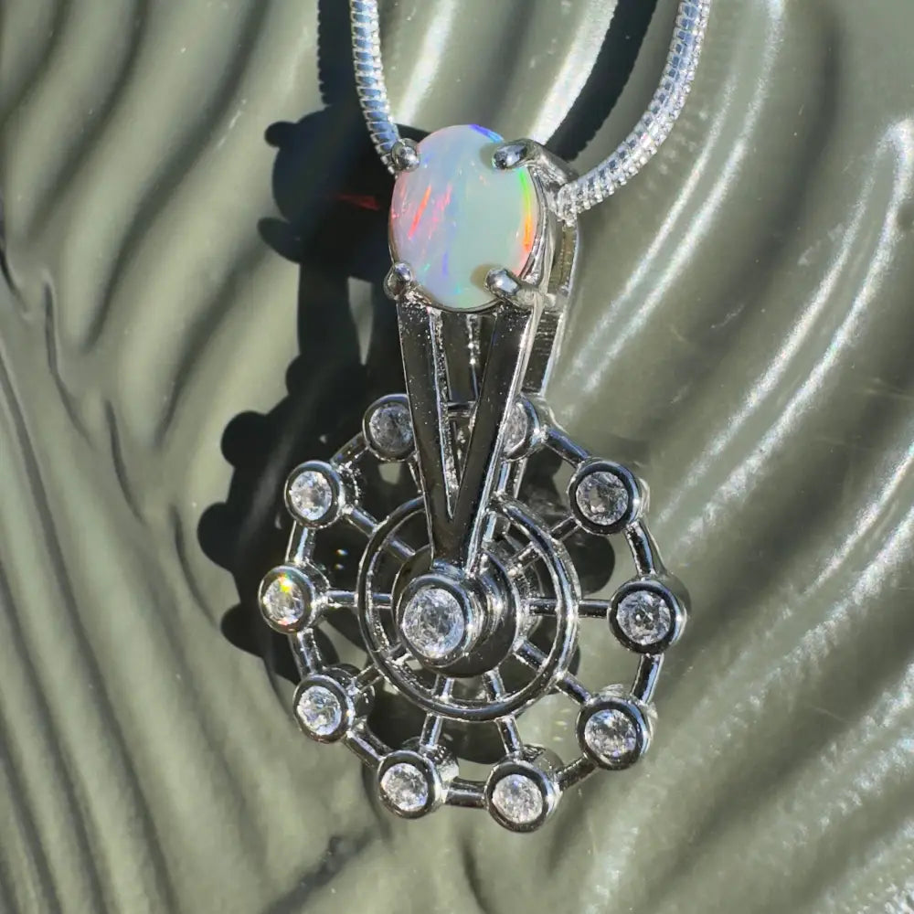 Opal and diamond pendant necklace with spinning Ferris wheel design in sterling silver