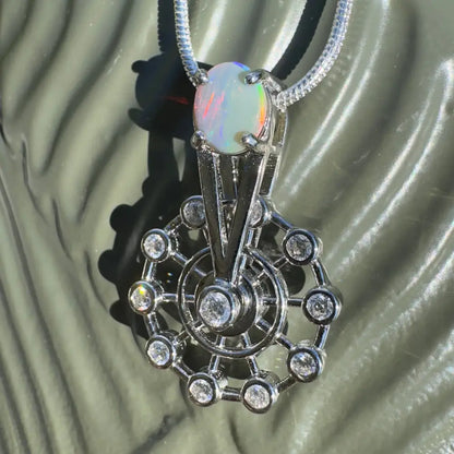Opal and diamond pendant necklace with spinning Ferris wheel design in sterling silver