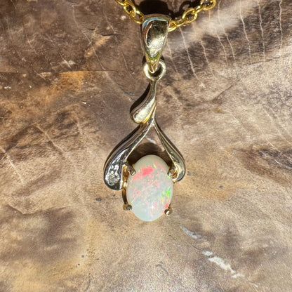 Gold and silver opal pendant necklace featuring a handcrafted Coober Pedy opal and natural diamonds