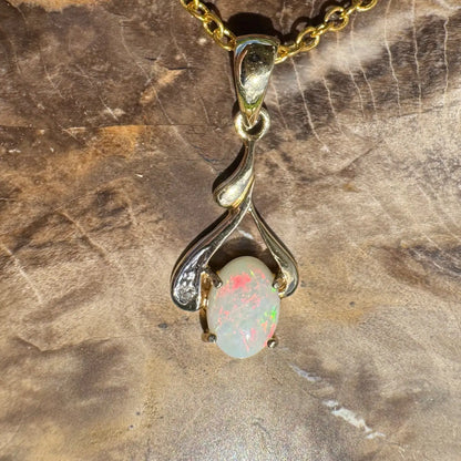 Gold chain necklace with a 0.7ct Coober Pedy opal pendant and natural diamonds
