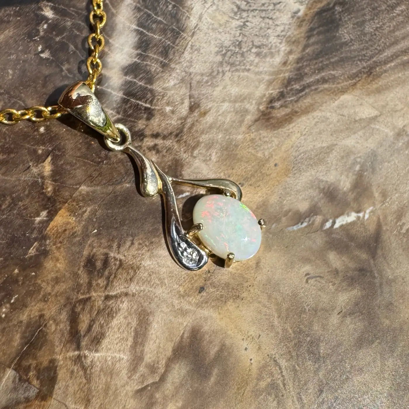 Gold chain necklace with a Coober Pedy opal and natural diamond pendant