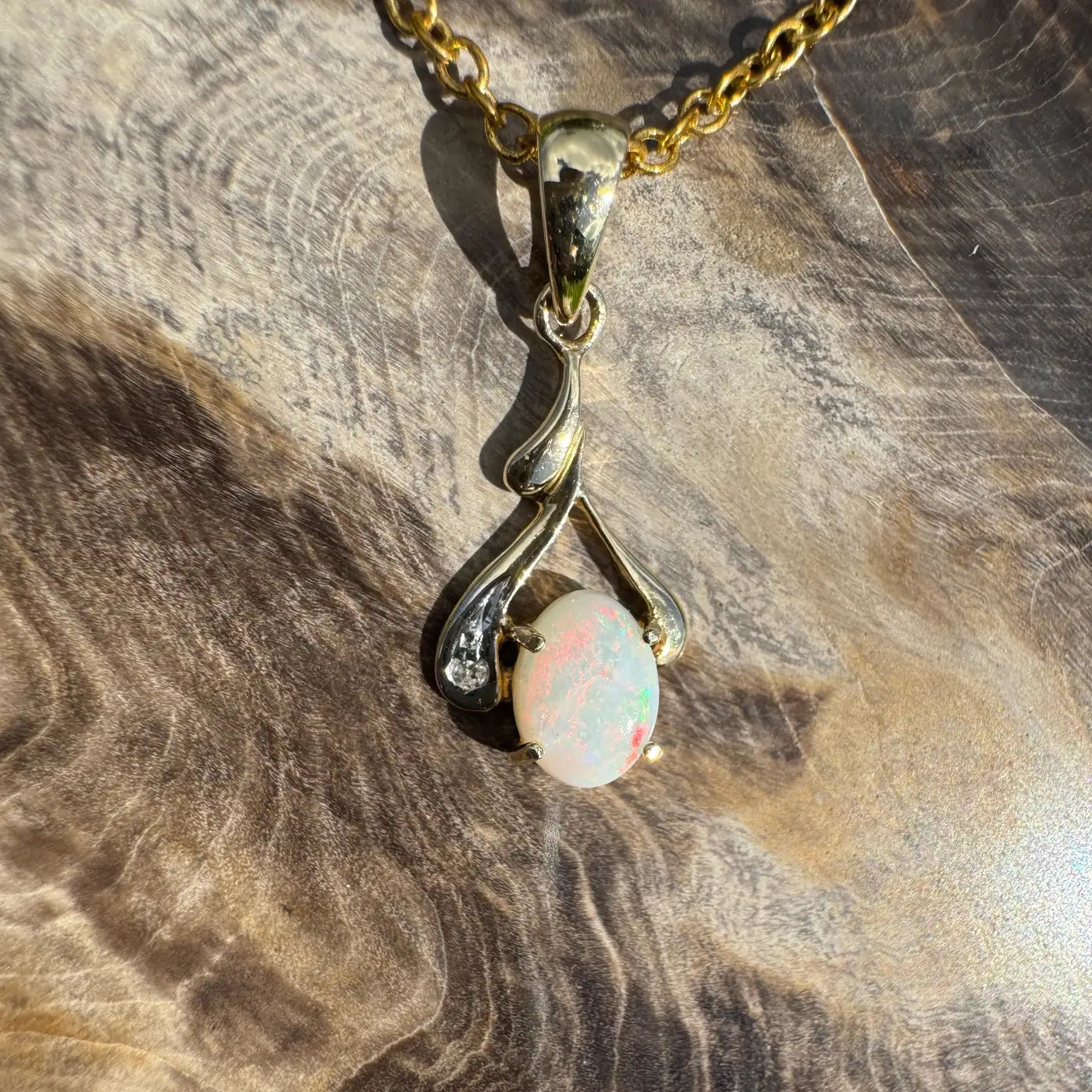 Gold chain necklace with a Coober Pedy opal and natural diamond pendant