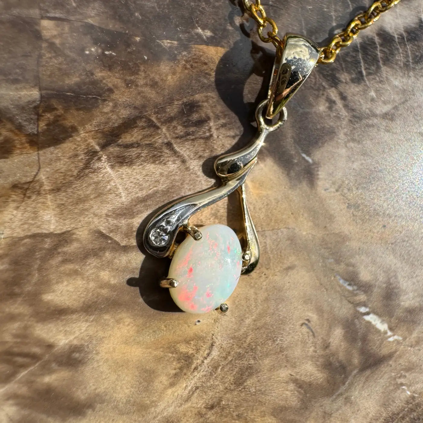 Gold pendant necklace with a 0.7ct Coober Pedy opal and natural diamonds on Australian gold