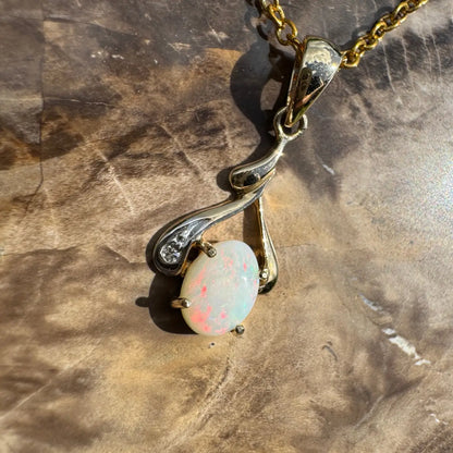 Gold pendant necklace with a 0.7ct Coober Pedy opal and natural diamonds on Australian gold