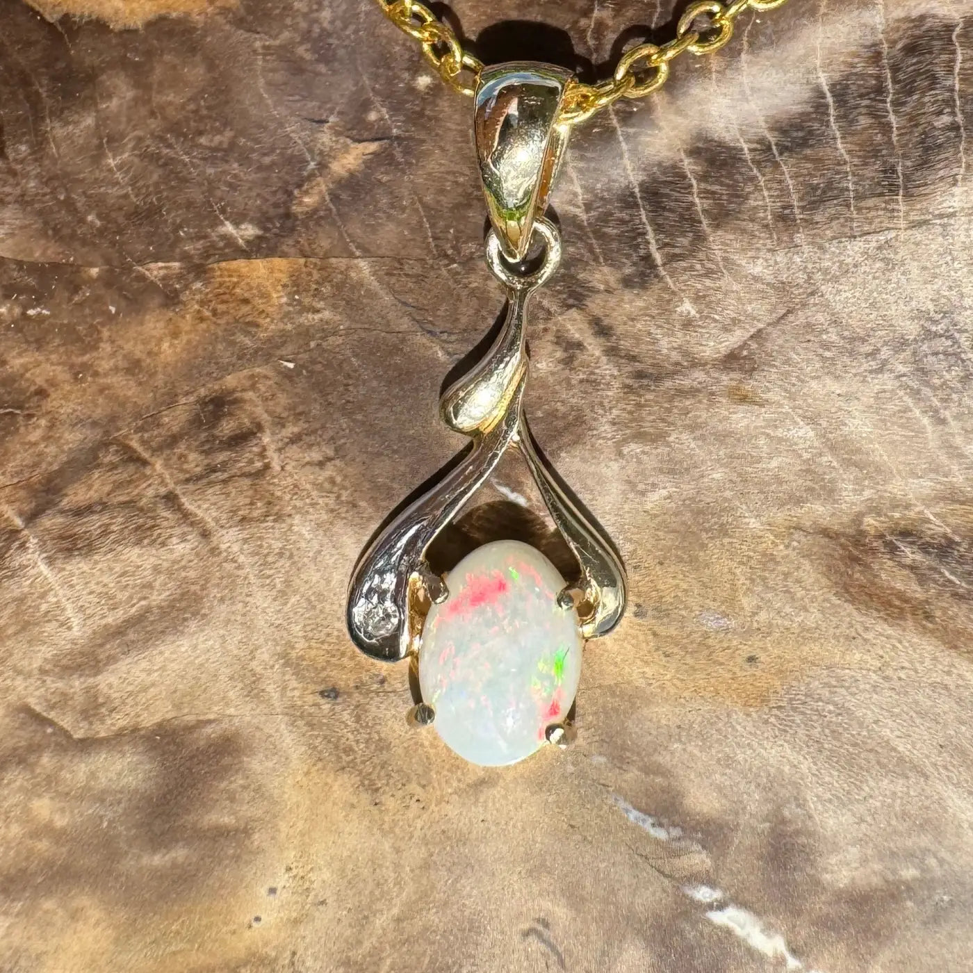Gold chain with handcrafted 0.7ct Coober Pedy opal pendant and natural diamonds