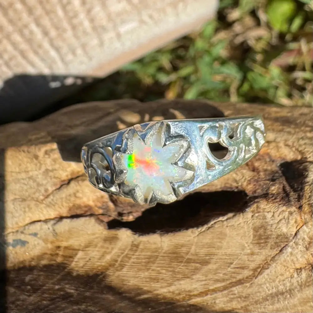 Silver ring featuring a handcrafted flower-shaped Coober Pedy opal in sterling silver