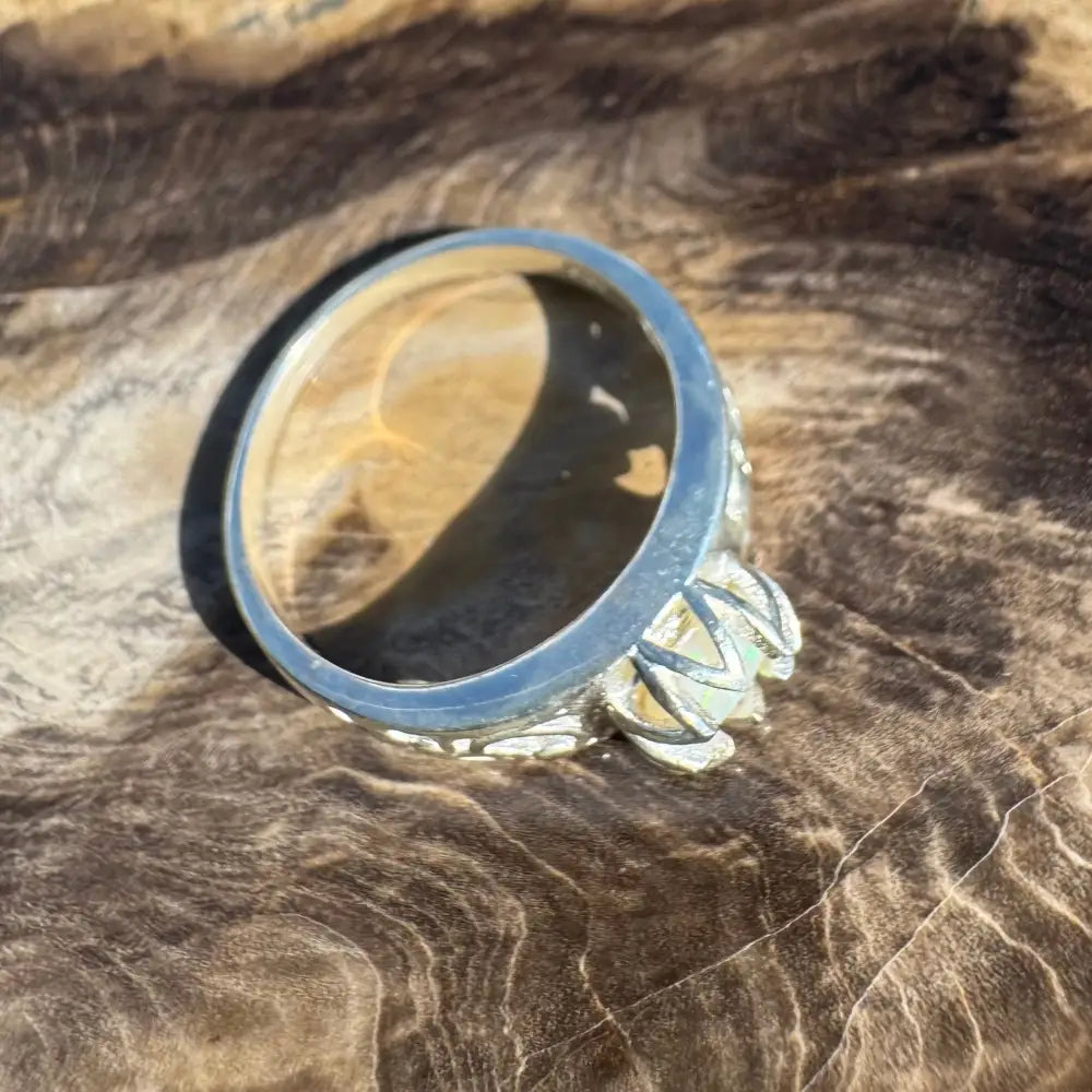 Silver ring with a pale Coober Pedy Opal gemstone in a handcrafted design