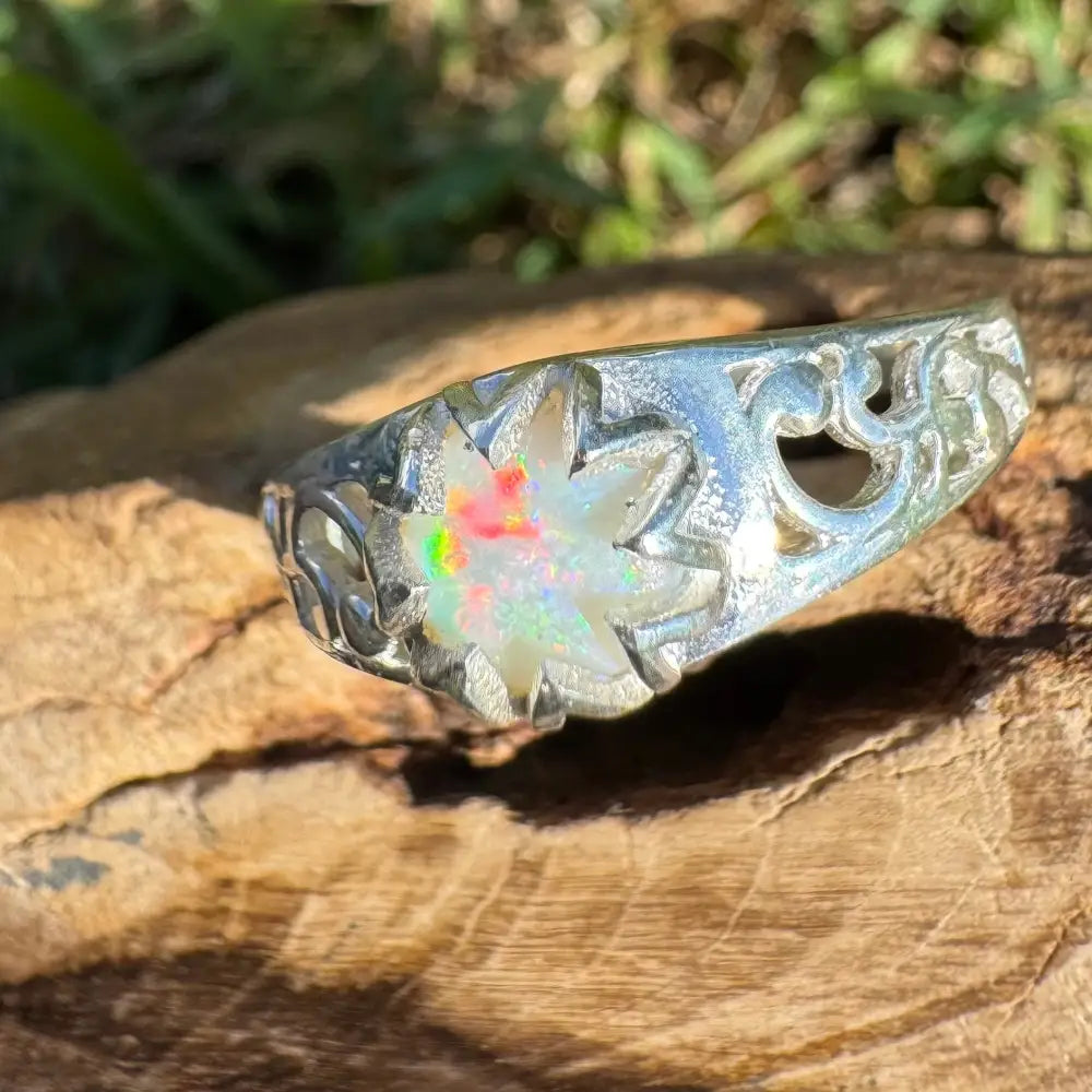 Silver ring featuring a 0.9ct Coober Pedy opal gemstone in a handcrafted design