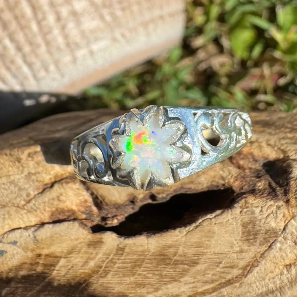 Silver ring featuring an opal flower with a 0.9ct Coober Pedy Opal in sterling silver