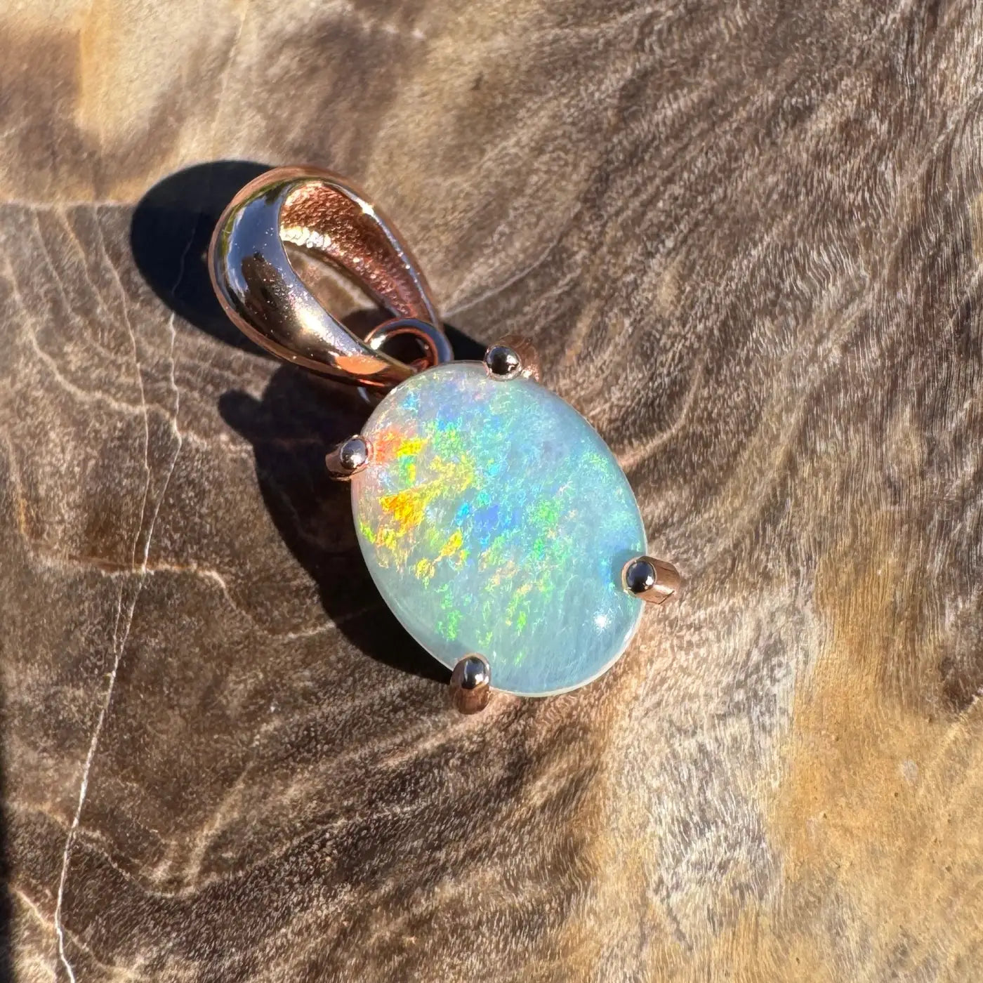 Oval opal pendant with rose gold setting from the Great Ocean Drift collection