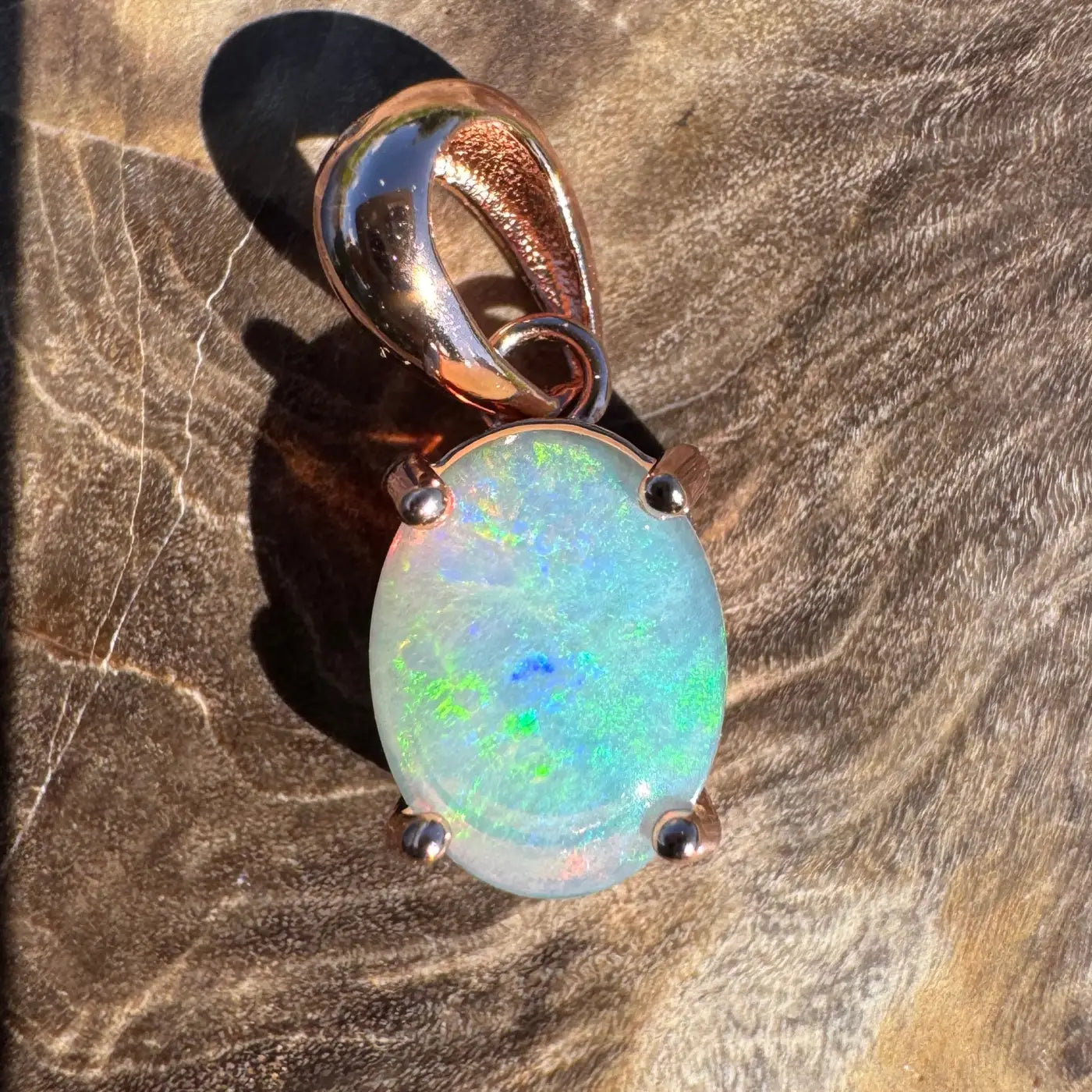 Oval opal pendant with rose gold setting in handcrafted Great Ocean Drift jewelry piece
