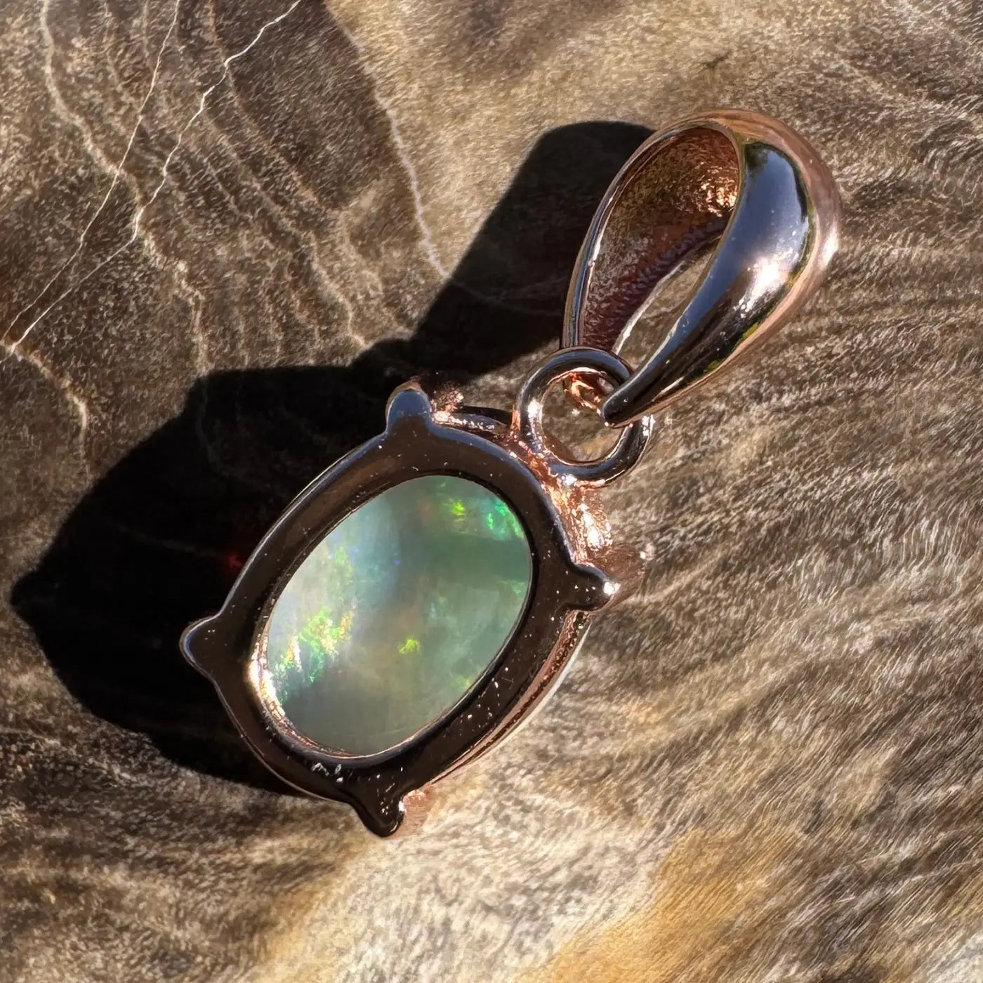 Rose gold opal pendant from the Great Ocean Drift collection featuring Lightning Ridge crystal opal